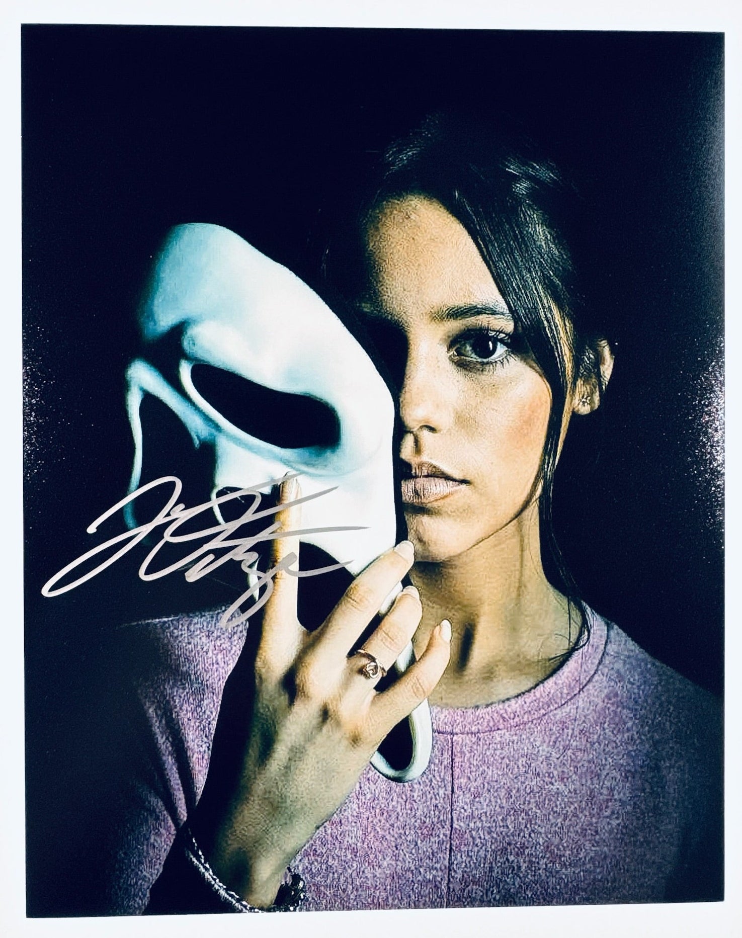 A professional 8x10 photograph featuring an authentic autograph by actress Jenna Ortega.