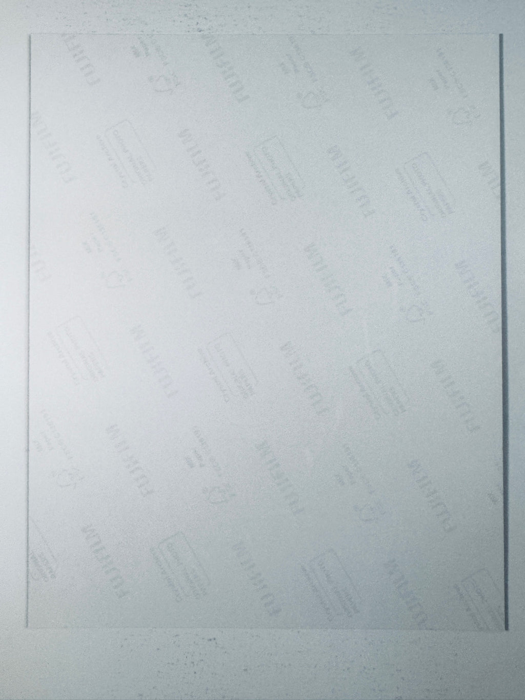 Fujifilm Crystal Archive photographic paper back surface showing the authentic backing and matte paper texture for the Jeremy Renner signed photo.