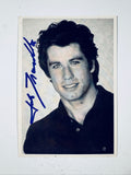 Full view black and white headshot photograph of actor John Travolta hand-signed in blue ink.