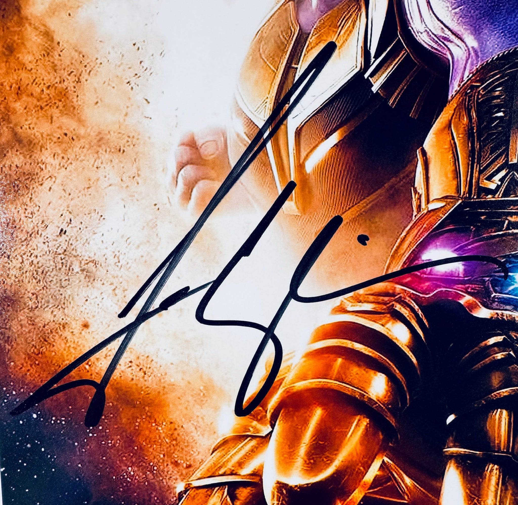 Close-up of Josh Brolin's signature in black marker on the Thanos signed 8x10 photo.