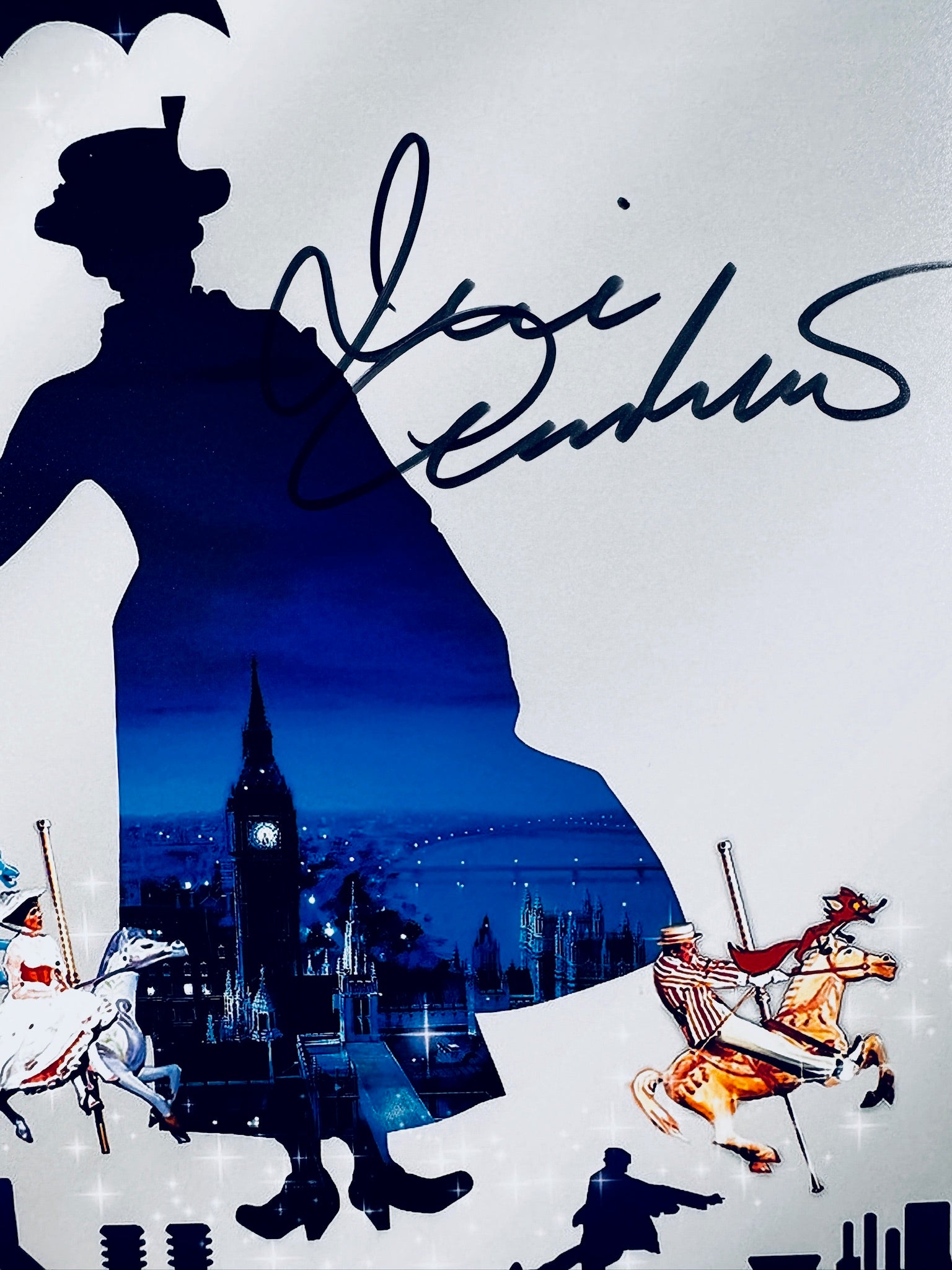 Close-up view of Julie Andrews's signature in black marker across the Mary Poppins art print.