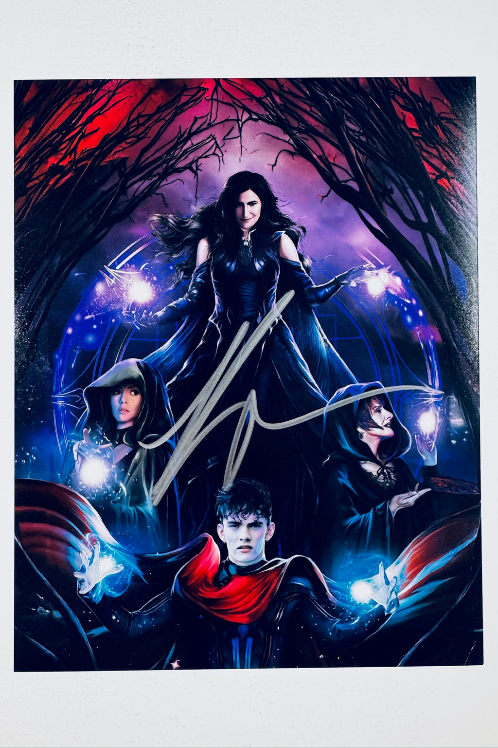 Signed full photo of Kathryn Hahn surrounded by the coven from Agatha All Along with magical energy, featuring a gold autograph.