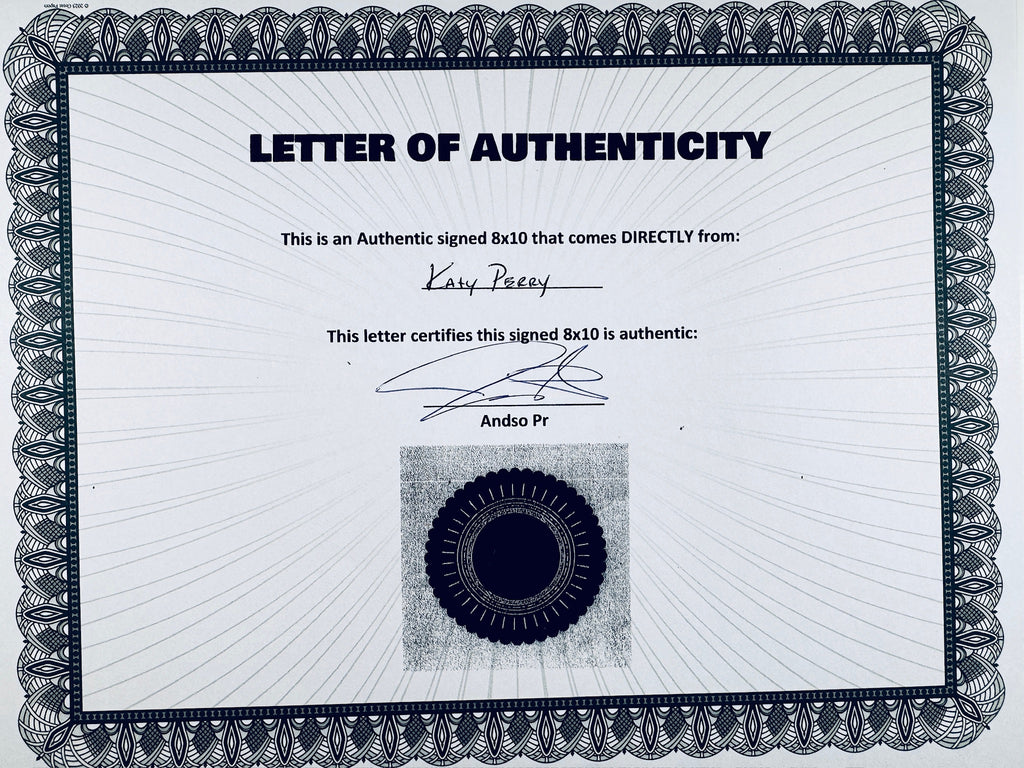 A Letter of Authenticity with a decorative blue-patterned border, certifying an authentic signed 8x10 coming directly from Katy Perry, featuring a dark circular seal graphic at the bottom.