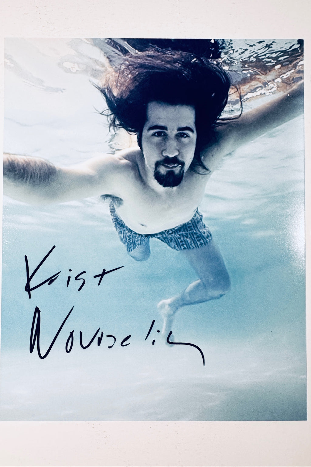Krist Novoselic hand-signed 8x10 matte photo swimming underwater in the iconic Nirvana style.