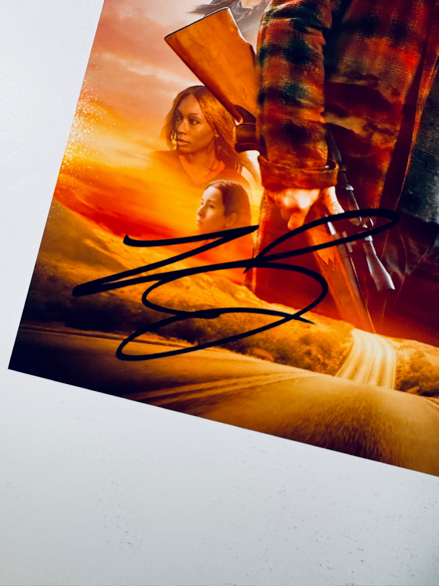 Close-up of Leonardo DiCaprio's signature in black marker on the signed One Battle After Another 8x10 photo.