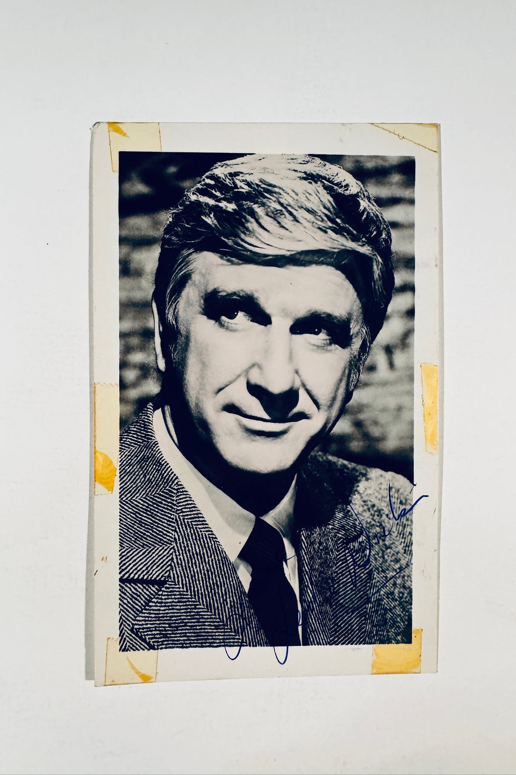 Leslie Nielsen autographed vintage studio portrait photograph signed in blue ink.