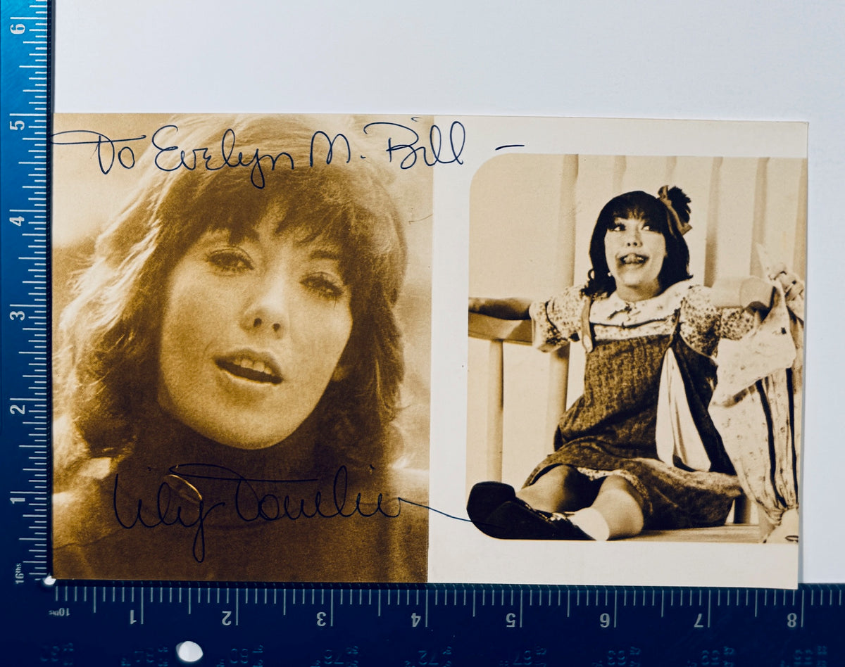 Vintage autographed Lily Tomlin signed promotional photo displayed next to a measuring ruler for scale.