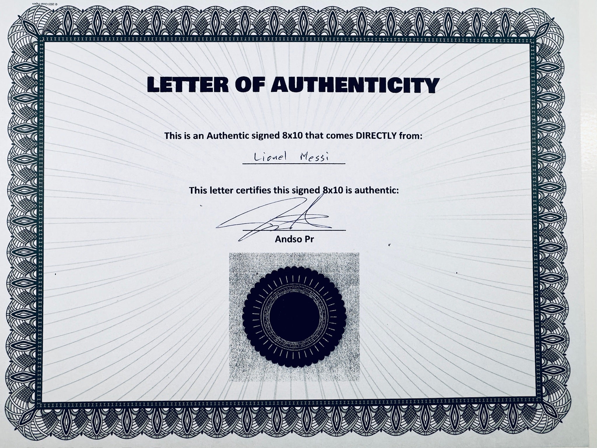 A Letter of Authenticity with a decorative blue-patterned border, certifying an authentic signed 8x10 coming directly from Lionel Messi, featuring a dark circular seal graphic at the bottom.