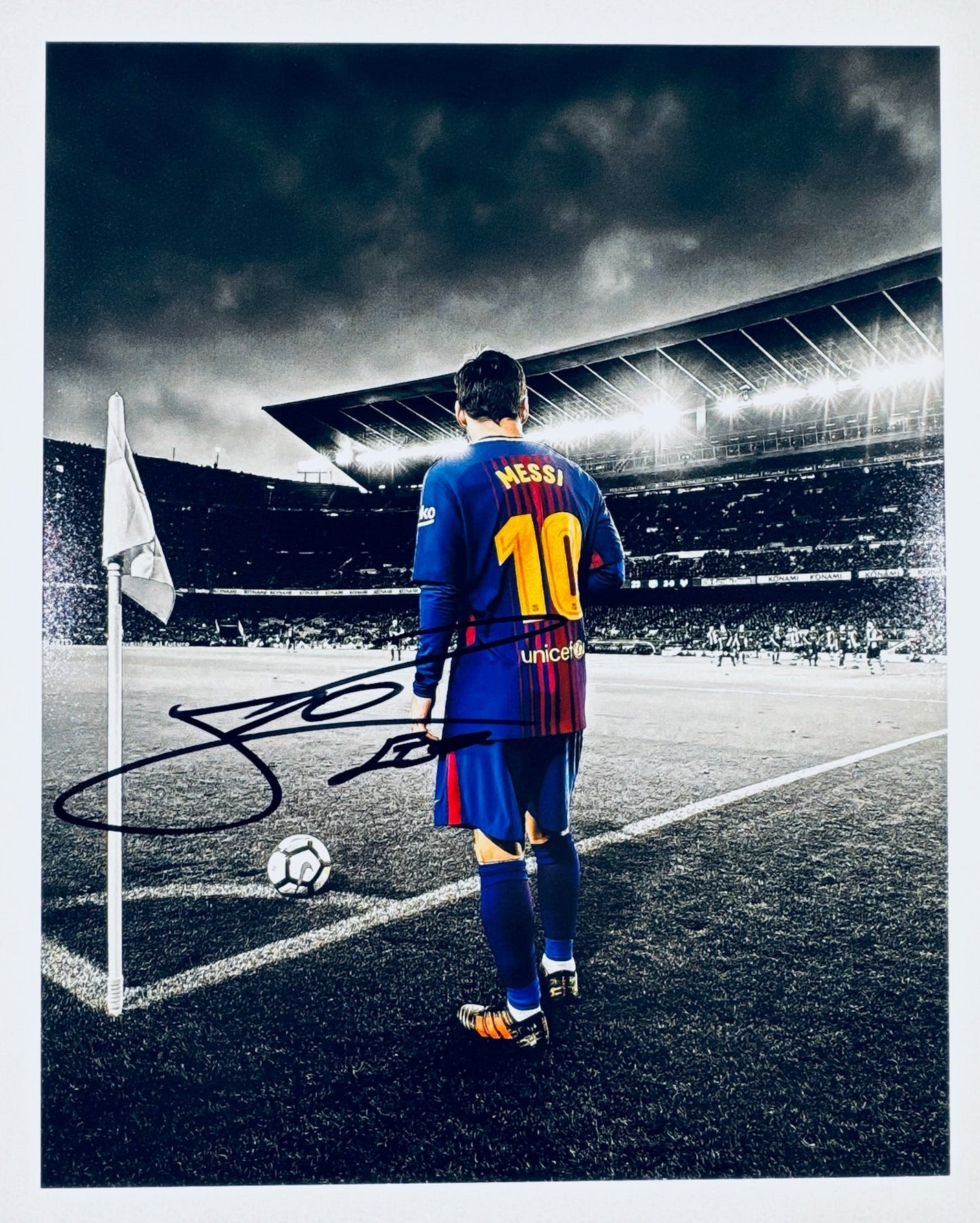 A professional 8x10 matte photograph featuring an authentic autograph by soccer star Lionel Messi