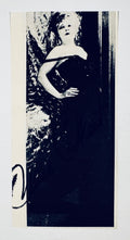 Full front view of vintage black and white newsprint cut photo signed by Hollywood actress Mae West.
