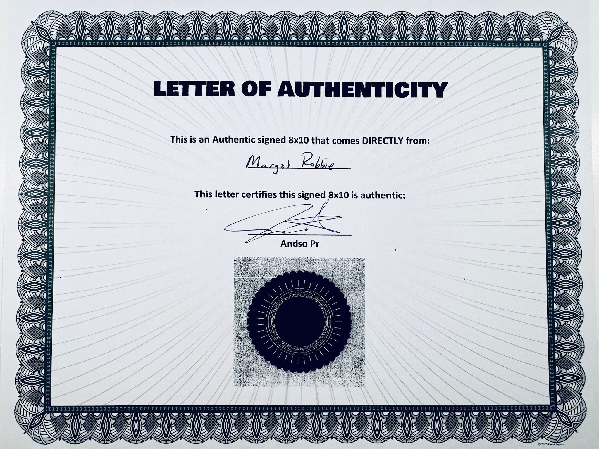 A Letter of Authenticity with a decorative blue-patterned border, certifying an authentic signed 8x10 coming directly from Margot Robbie, featuring a dark circular seal graphic at the bottom.