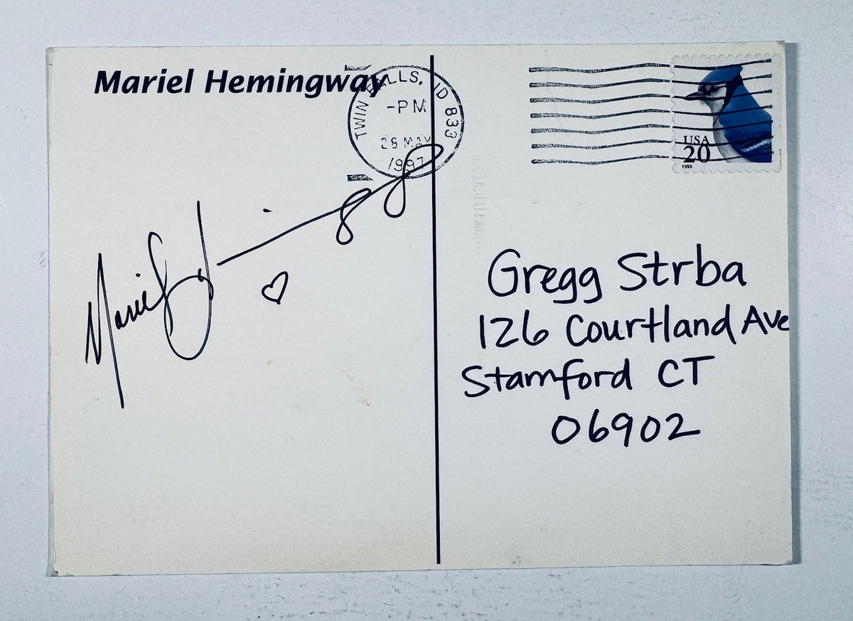 Back of an authentic postmarked postcard autographed by Mariel Hemingway with a hand-drawn heart in black ink.