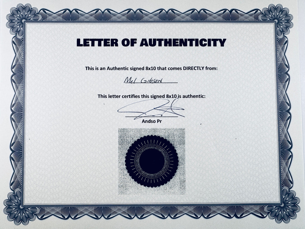 A Certificate of Authenticity featuring a decorative blue-patterned border, text certifying an authentic signed 8x10 from Mel Gibson, a signature, and a dark circular seal graphic at the bottom center.