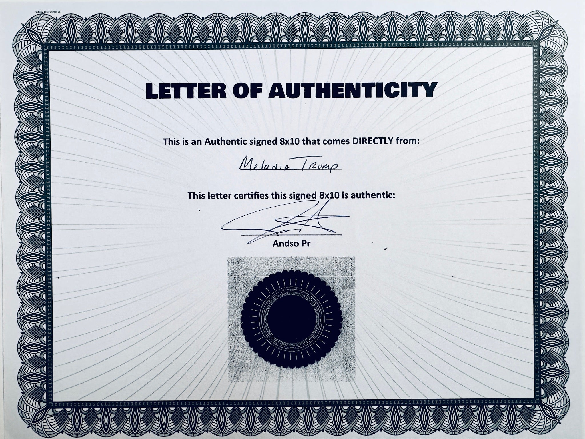 A Letter of Authenticity with a decorative patterned border and a dark seal, certifying an authentic signed 8x10 coming directly from Melania Trump, featuring a signature at the top.
