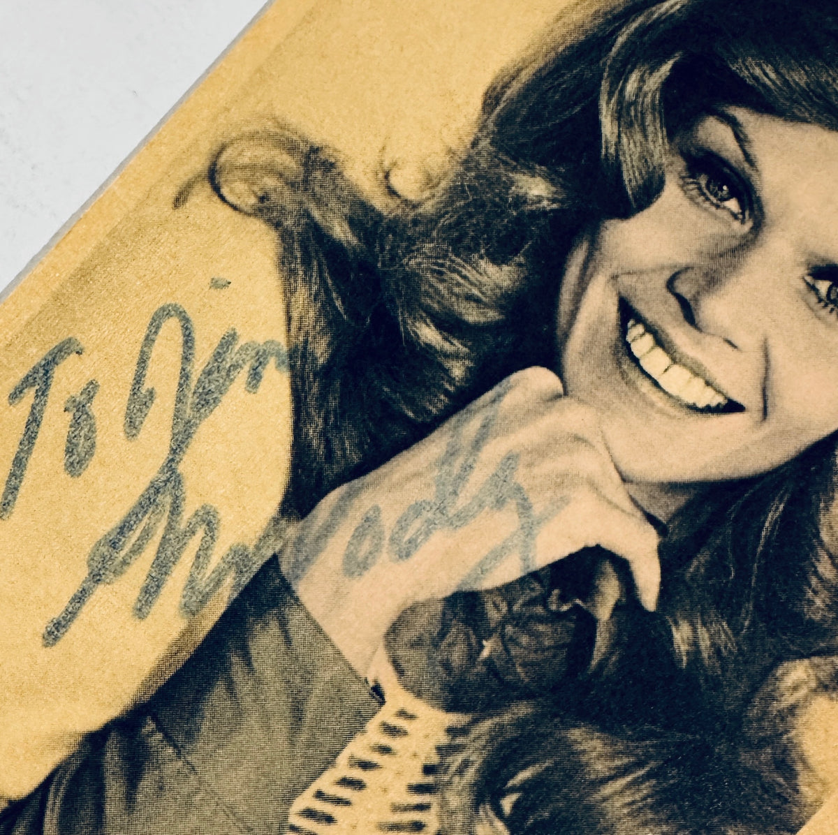 Close-up view of Melody Patterson autograph and handwritten inscription reading 'To Jim Melody'.