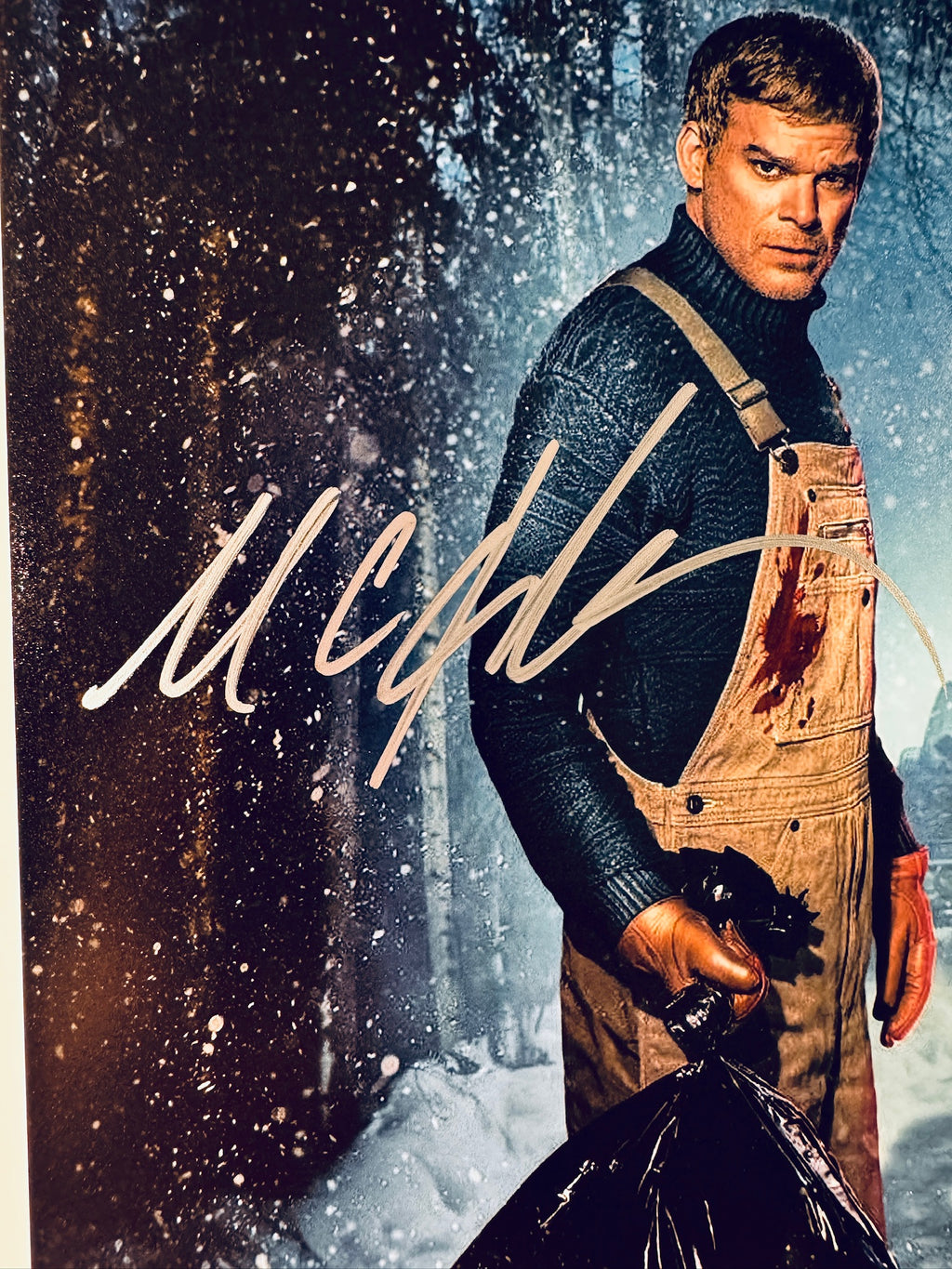 Close-up of Michael C. Hall's signature in silver marker on the signed Dexter: New Blood 8x10 photo.