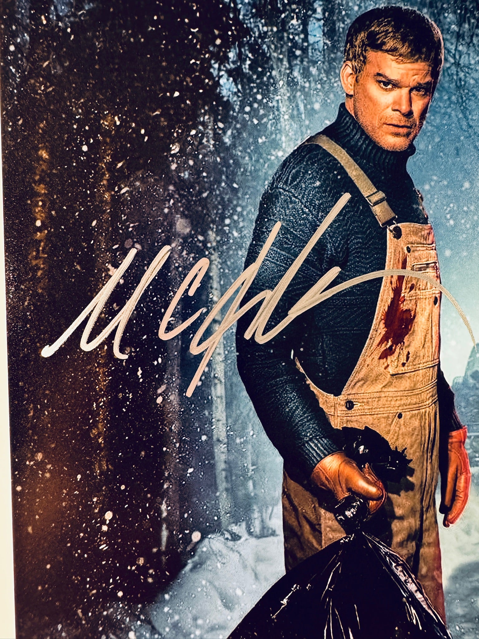Close-up of Michael C. Hall's signature in silver marker on the signed Dexter: New Blood 8x10 photo.