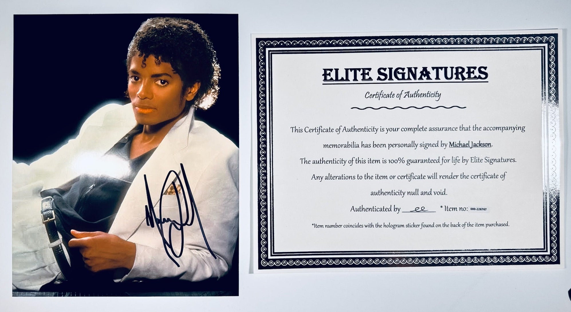A view of the Michael Jackson hand-signed photograph displayed next to its Certificate of Authenticity.