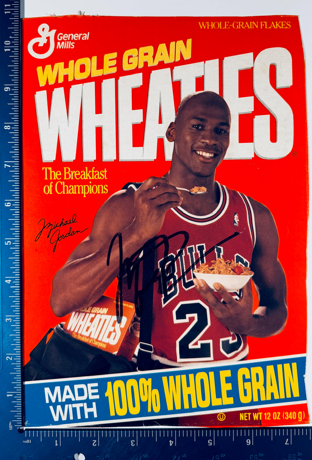 Michael Jordan signed Wheaties cereal box panel with rulers along the left and bottom edges showing its size.