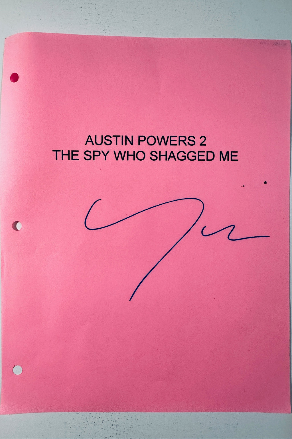 Full view of pink Austin Powers 2 The Spy Who Shagged Me script cover autographed by Michael York in blue ink.