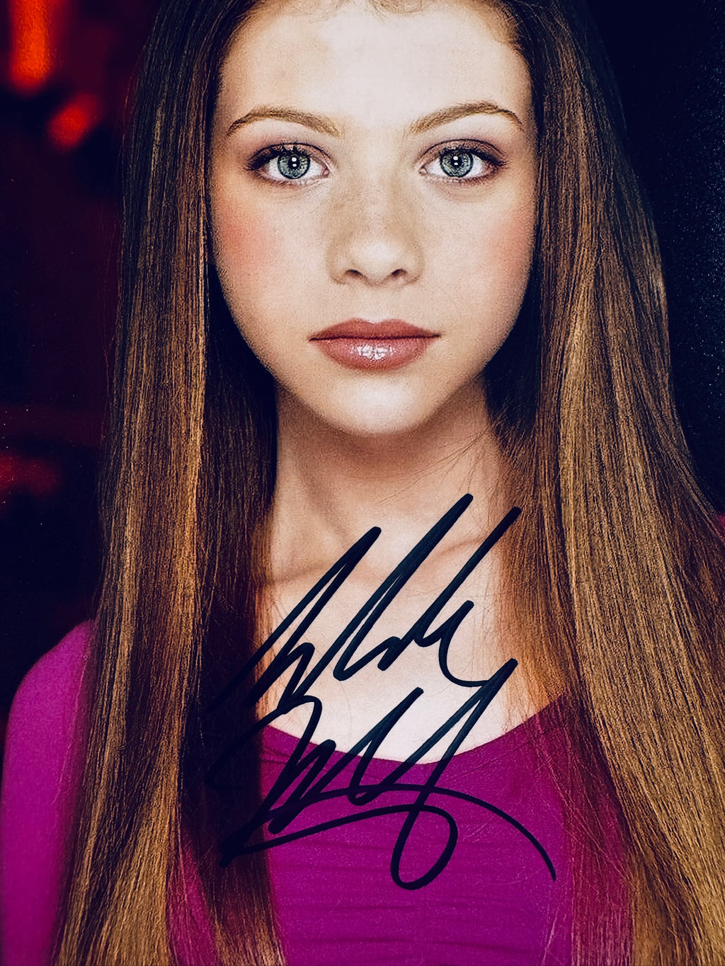 Close-up view of Michelle Trachtenberg's signature in black marker across the Buffy the Vampire Slayer promotional matte photo.