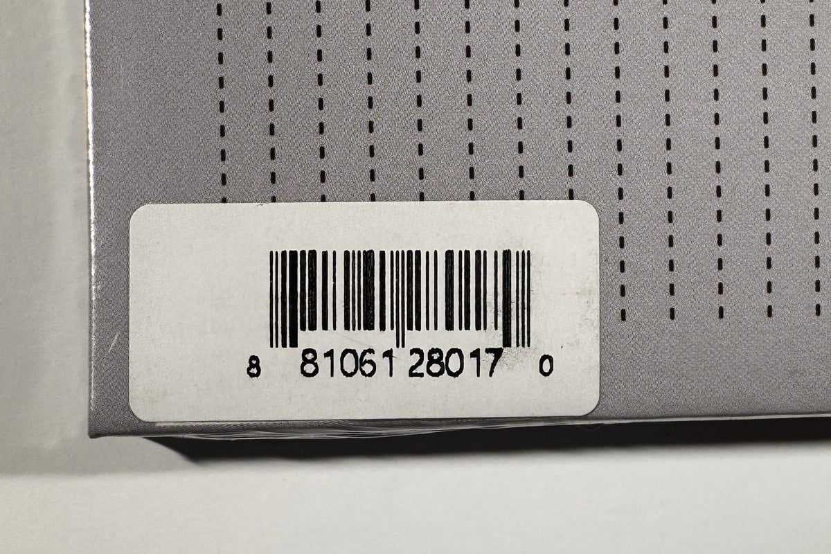 Close-up view of back cover barcode sticker displaying UPC 881061280170.