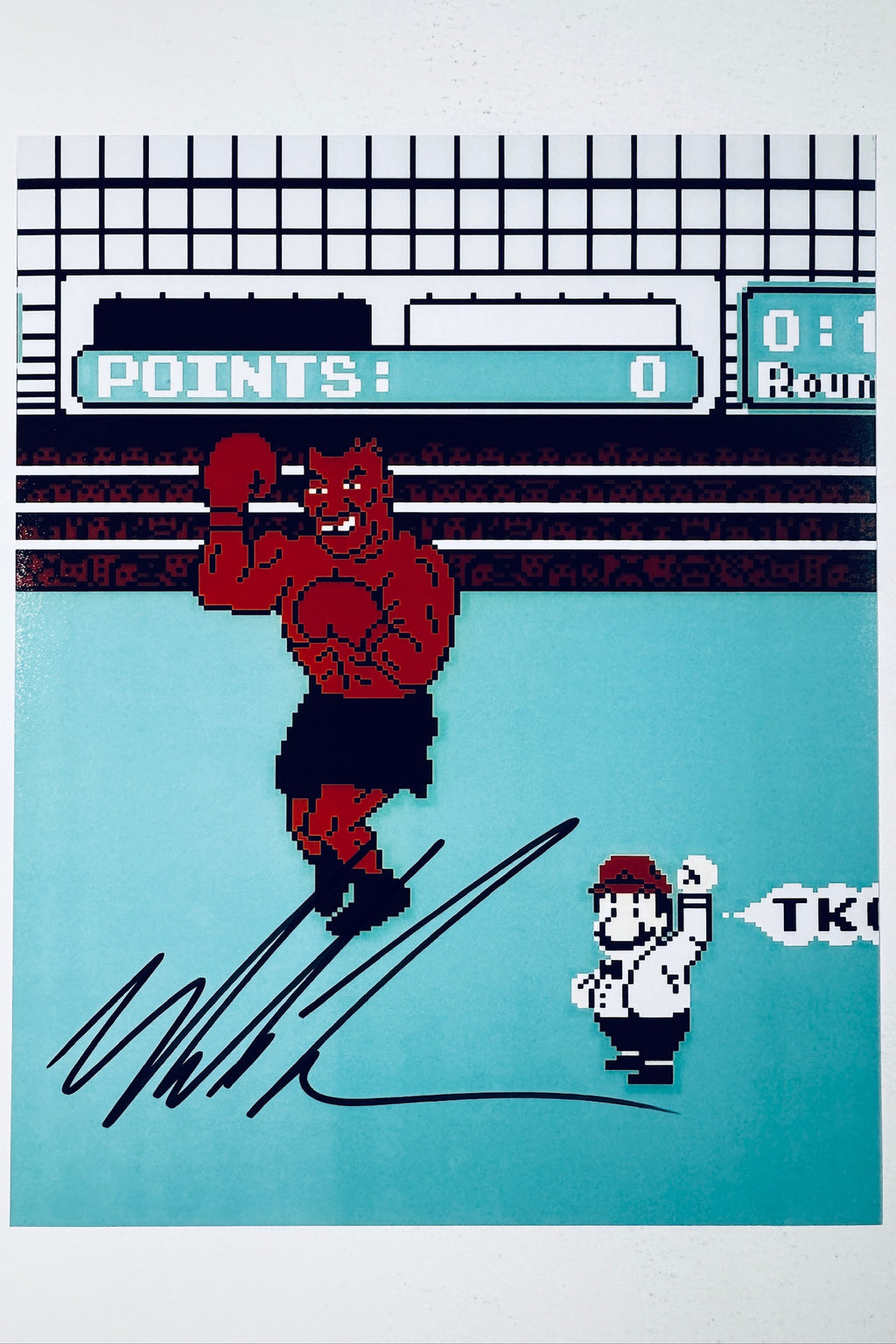 Mike Tyson hand-signed 8x10 matte photo featuring pixel art style from the classic video game Punch-Out!! with a referee declaring a TKO.