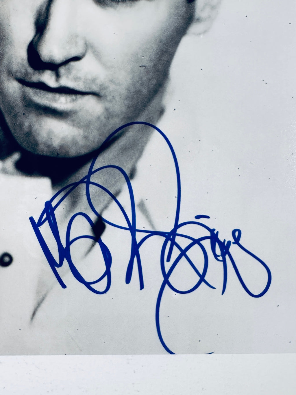 Close-up of Morrissey's signature in blue marker on the signed black and white 8x10 photo.