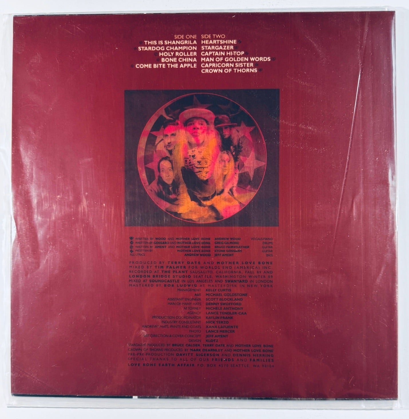 Back cover showing the tracklist and physical condition of the red-toned rear sleeve for the Mother Love Bone Apple vinyl release.
