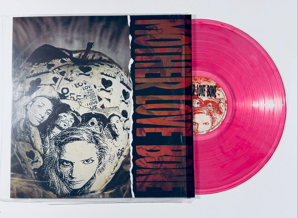 Front cover art and translucent pink vinyl record for the limited unofficial release of Mother Love Bone's album Apple, featuring the iconic collage artwork.