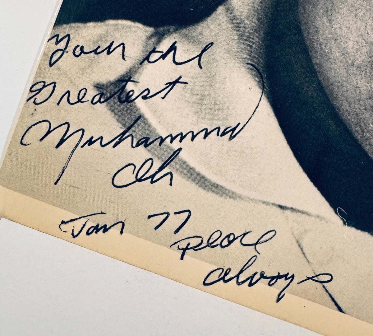 Close-up of Muhammad Ali hand-written autograph with inscription 'You're the greatest Muhammad Ali Jan 77 Peace always'.