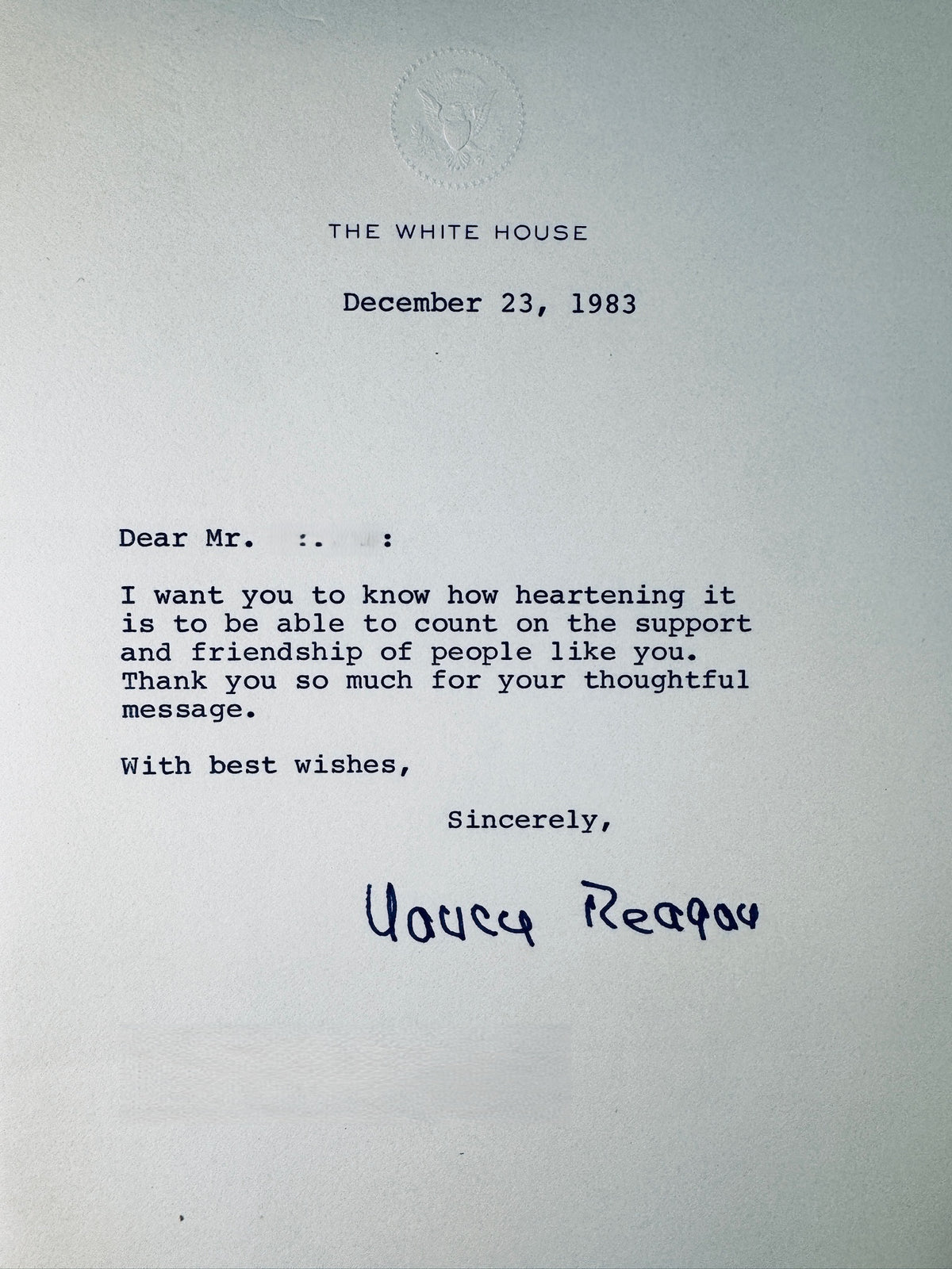 Full view of a 1983 White House letter with embossed presidential seal, typed message, and printed signature of Nancy Reagan.