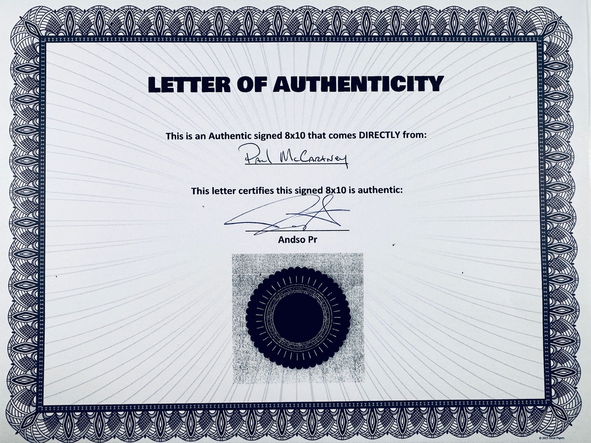 A Letter of Authenticity with a decorative blue-patterned border, certifying an authentic signed 8x10 coming directly from Paul McCartney, featuring a dark circular seal graphic at the bottom.