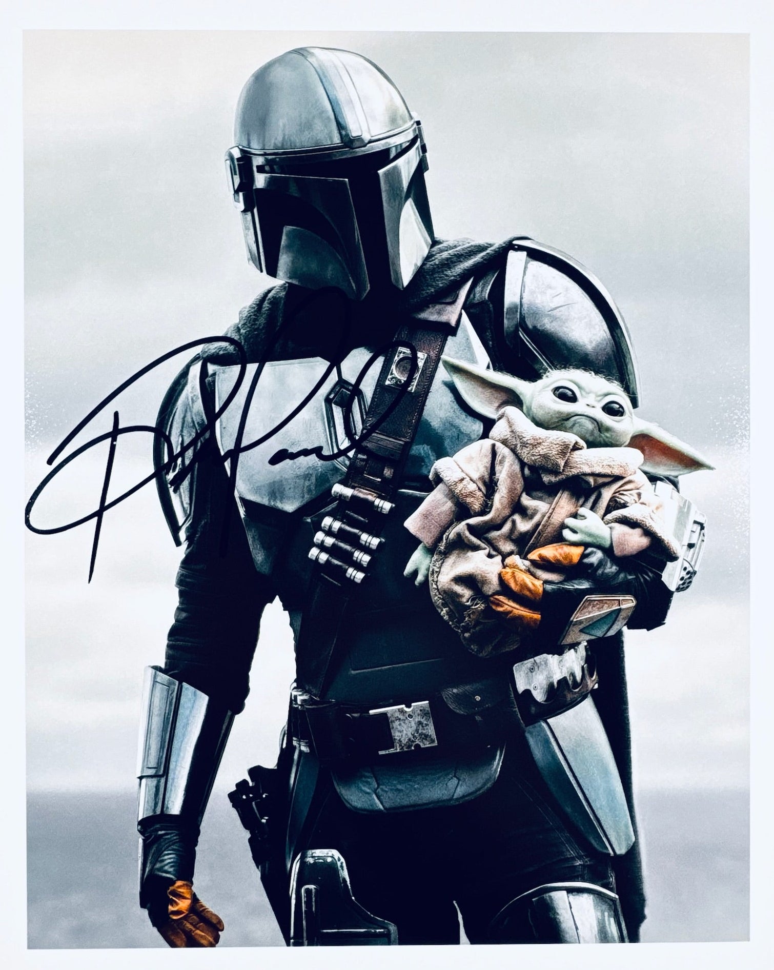 A professional 8x10 matte photograph featuring an authentic autograph by actor Pedro Pascal from The Mandalorian.