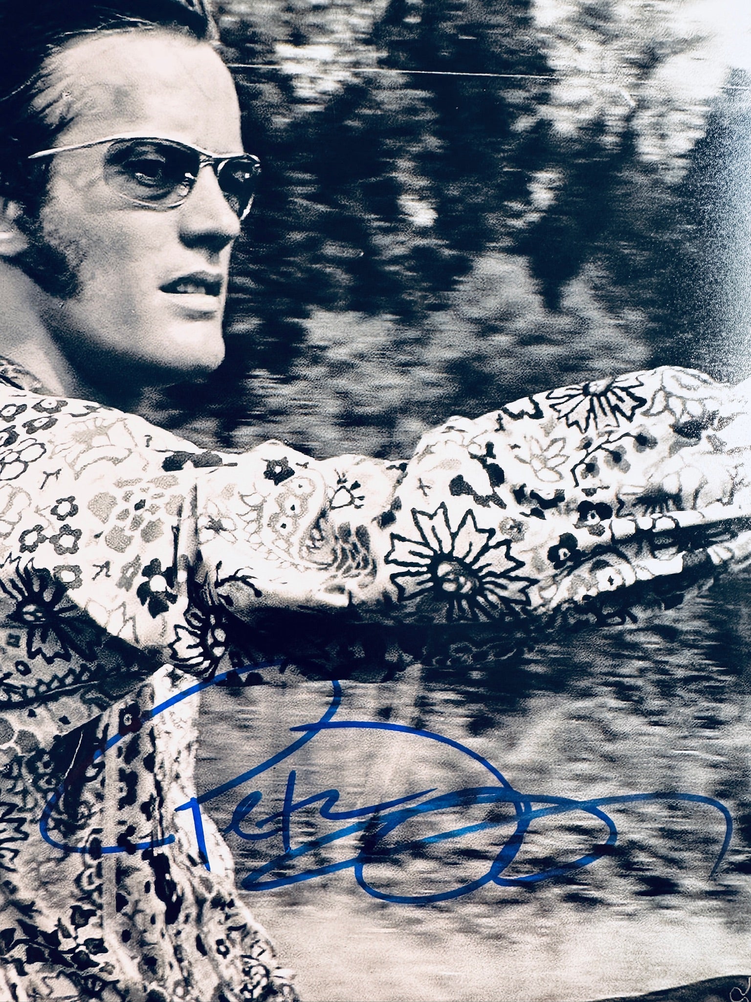 Close-up view of Peter Fonda's signature in blue marker across the black and white promotional motorcycle photo.
