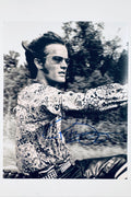 Signed 8x10 matte photo of Peter Fonda riding a motorcycle in a patterned shirt and sunglasses, featuring a bold blue ink autograph across the lower portion.