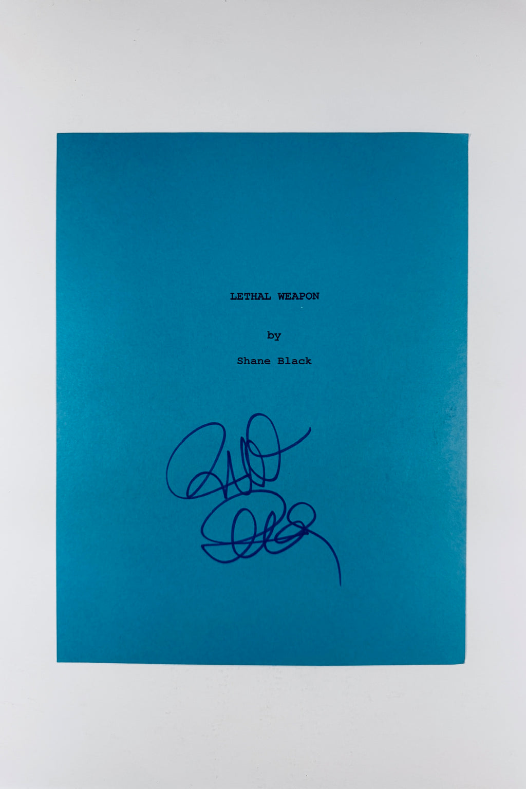 Full front view of blue Lethal Weapon script cover page hand-signed by director Richard Donner.