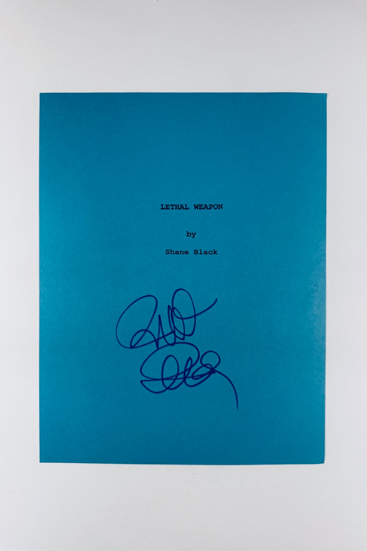 Full front view of blue Lethal Weapon script cover page hand-signed by director Richard Donner.