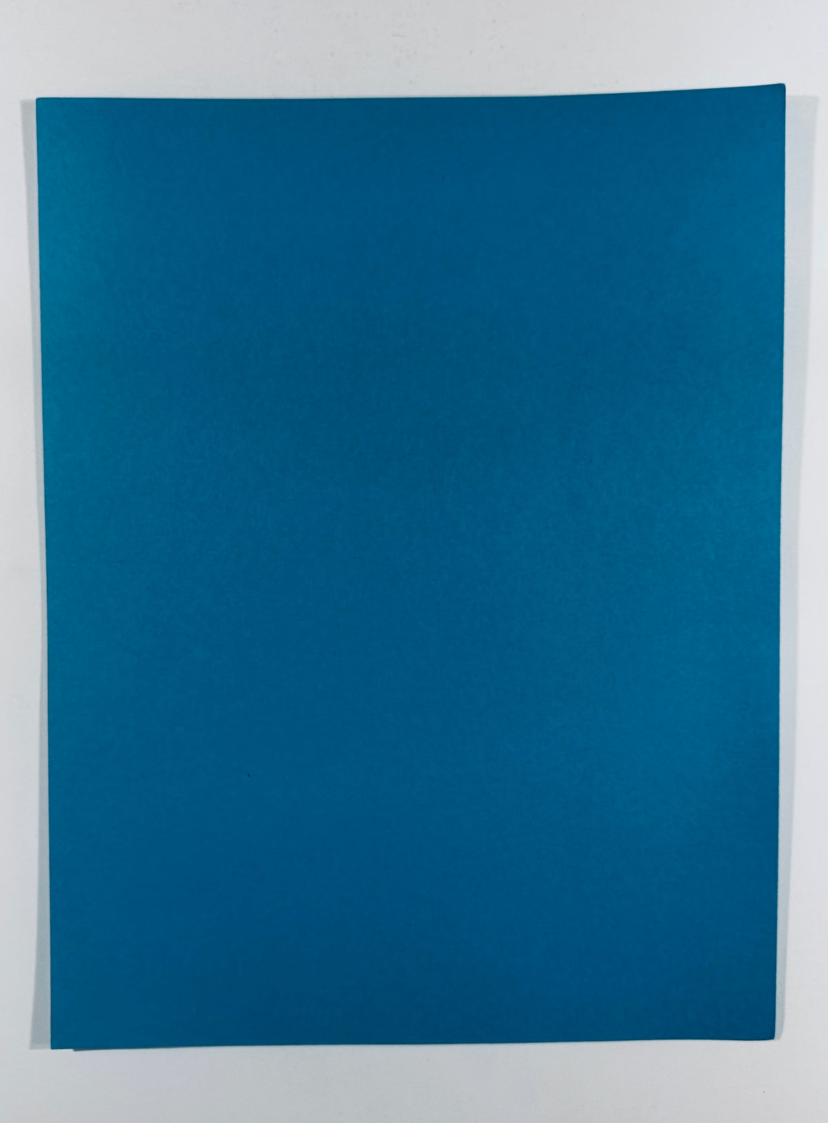 Full back view of the plain, blank blue cardstock script cover.