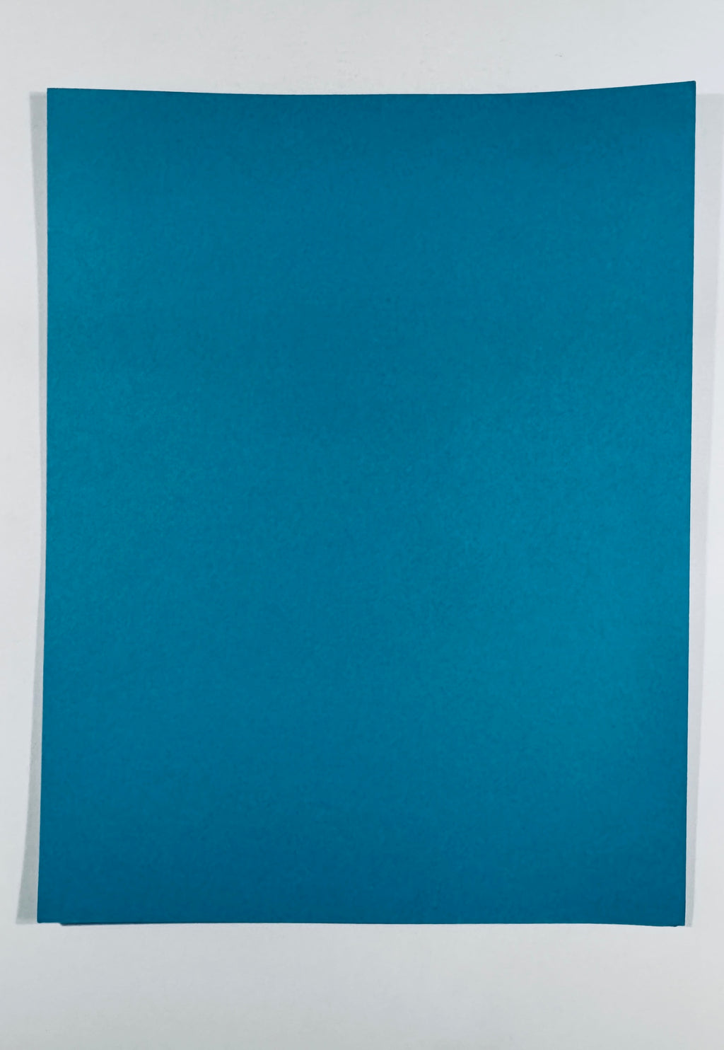 Full back view of the plain, blank blue cardstock script cover.