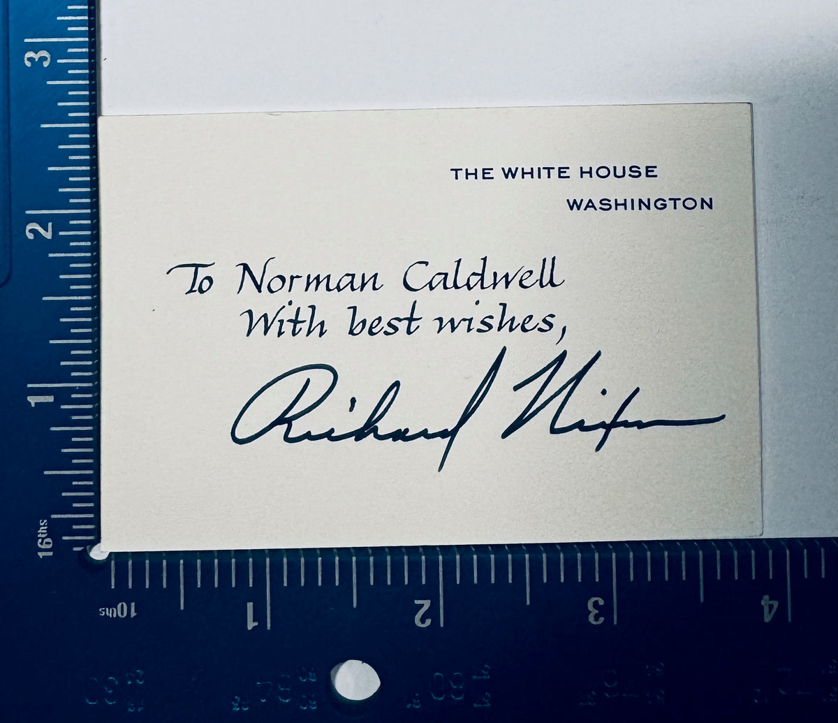 Richard Nixon autographed White House card placed against a ruler showing accurate dimensions.