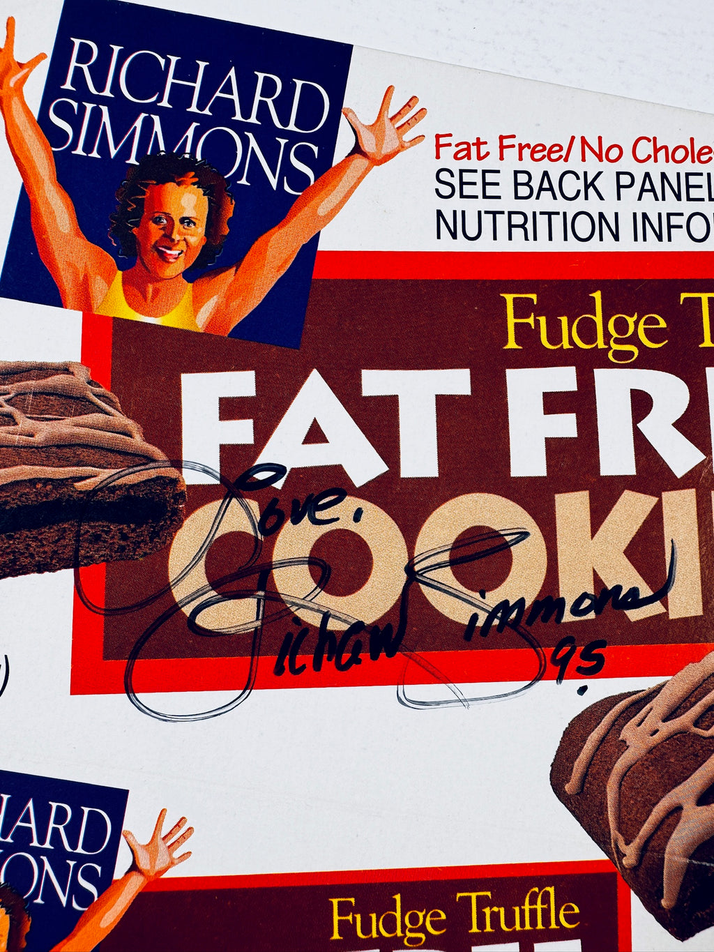 Close-up of Richard Simmons hand-signed autograph and inscription on a Fudge Truffle Fat Free Cookies box.
