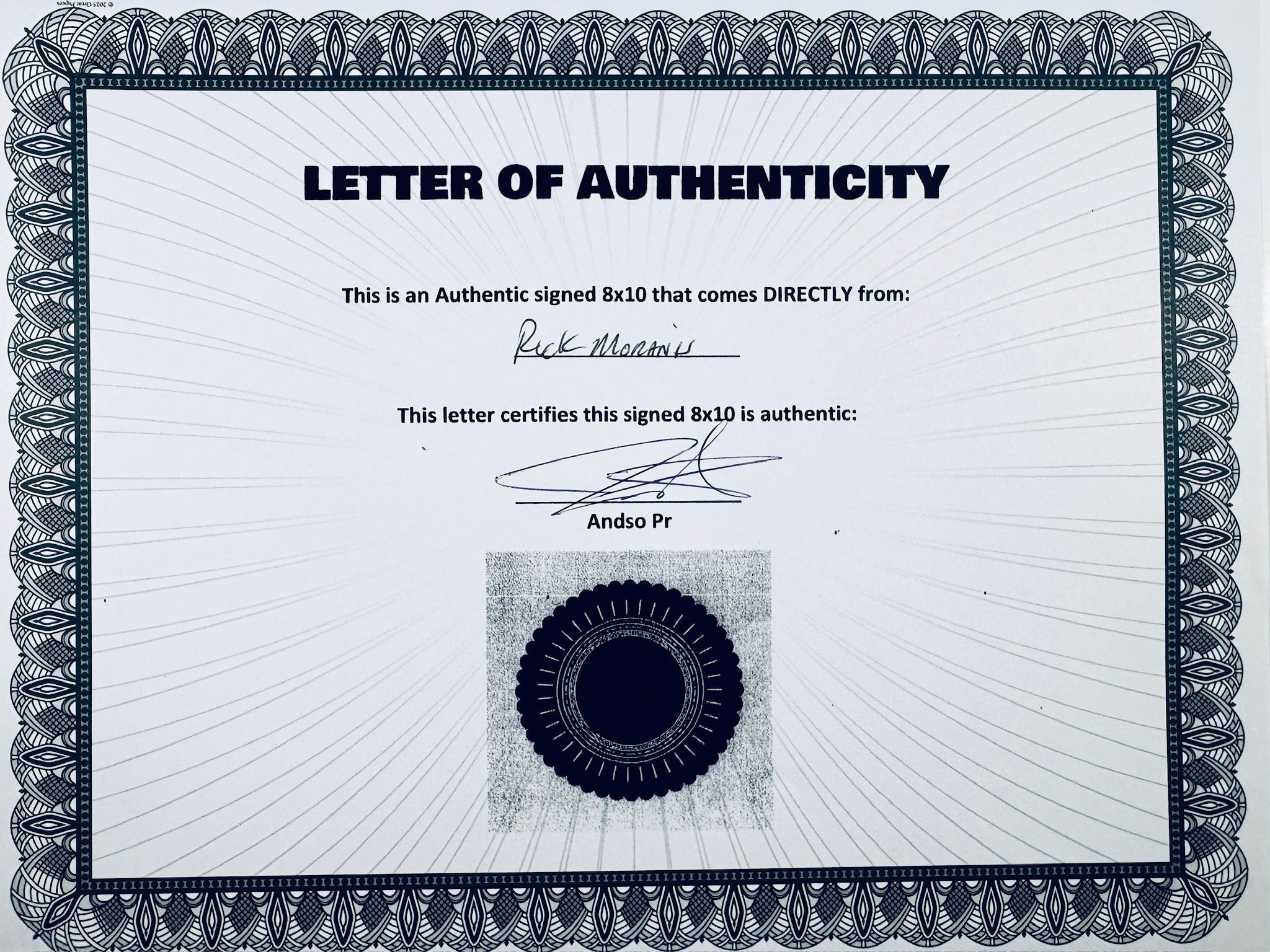 A Letter of Authenticity with a decorative blue-patterned border, certifying an authentic signed 8x10 coming directly from Rick Moranis, featuring a dark circular seal graphic at the bottom.