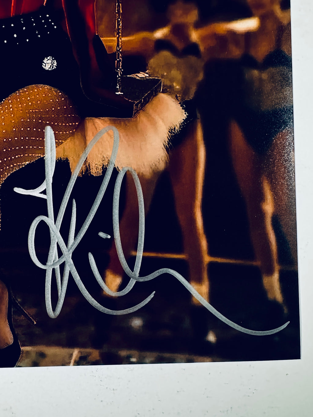 Close-up of Rihanna's signature in silver marker on the signed 8x10 photo.