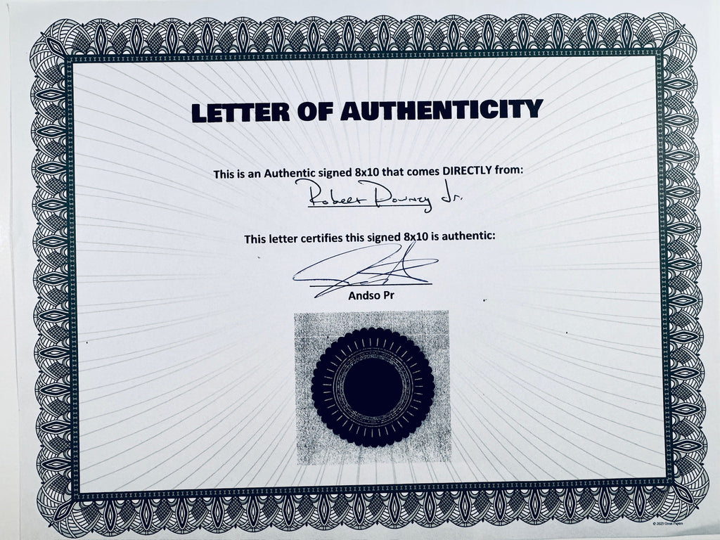 A Letter of Authenticity with a decorative blue-patterned border, certifying an authentic signed 8x10 coming directly from Robert Downey Jr., featuring a dark circular seal graphic at the bottom.