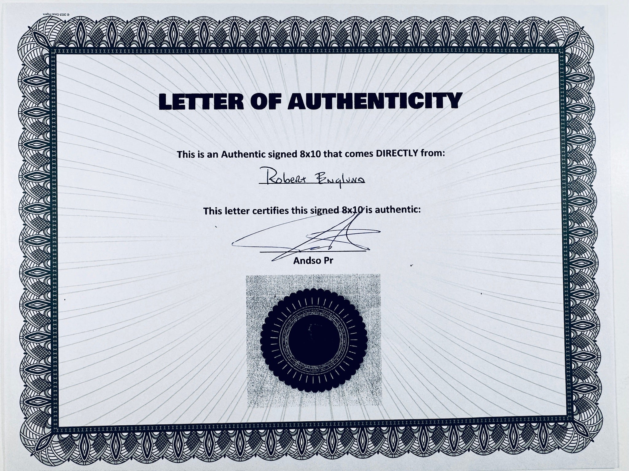 A Certificate of Authenticity featuring a decorative blue-patterned border, text certifying an authentic signed 8x10 from Robert Englund with mention of a COA, a signature, and a dark circular seal graphic at the bottom center.