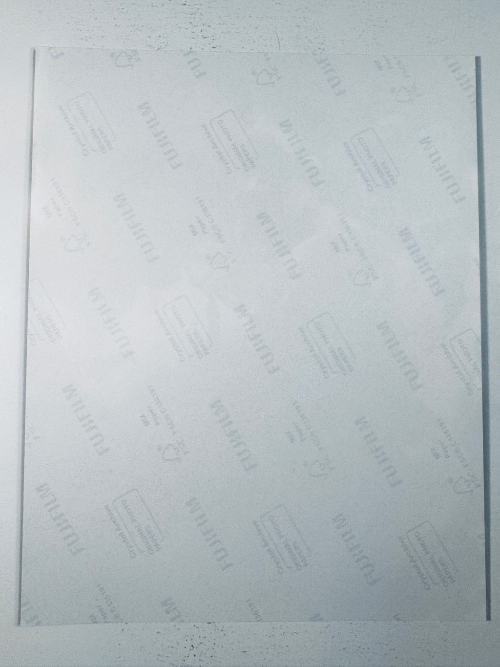 Fujifilm Crystal Archive photographic paper back surface showing the authentic backing and matte paper texture for the Robert Kraft and Tom Brady signed photo.