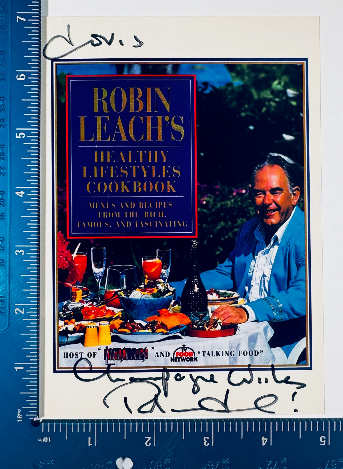 Autographed Robin Leach promotional card shown next to a measuring ruler for exact item dimensions.