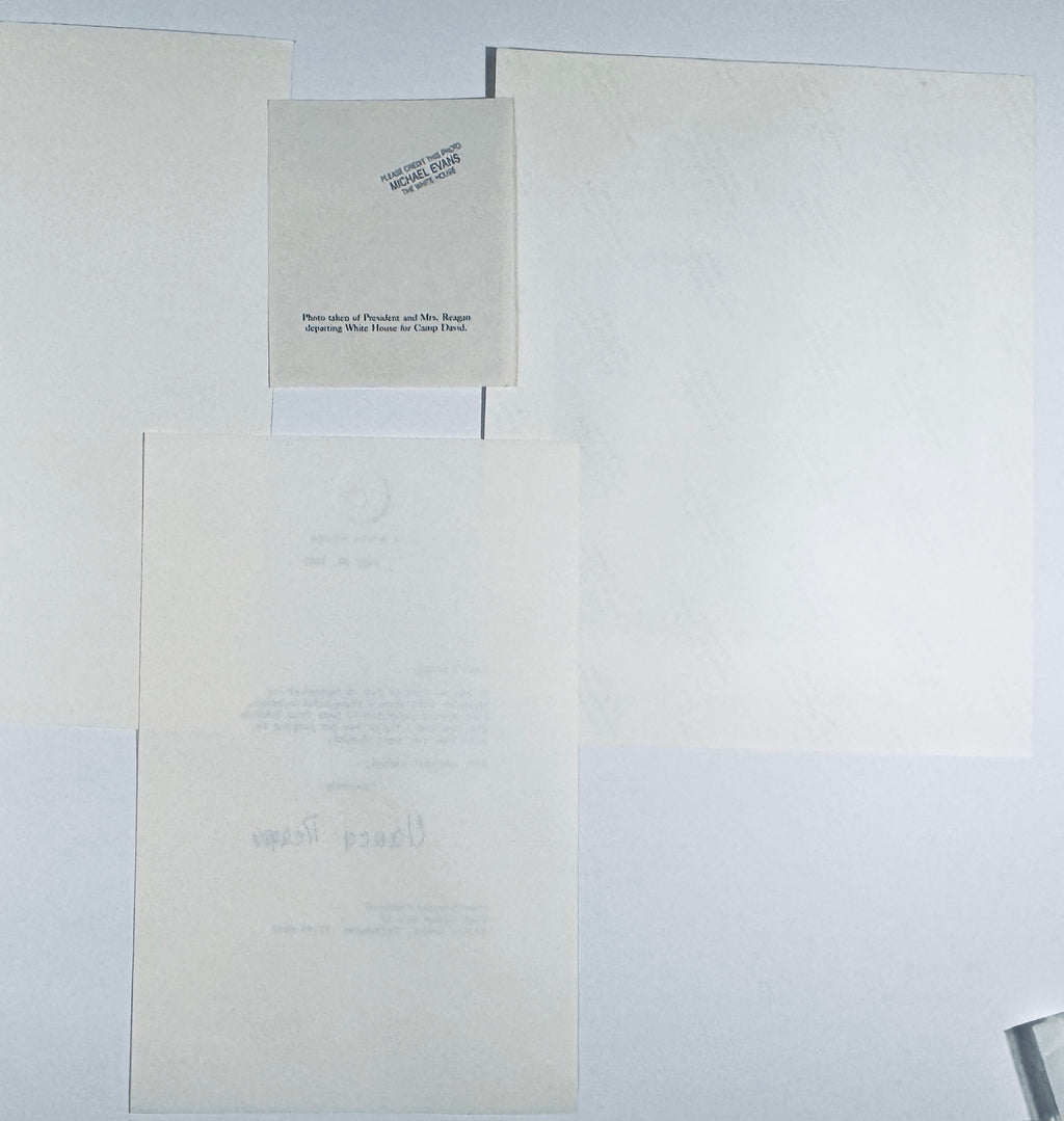 Backside of vintage Ronald and Nancy Reagan photograph showing official White House photographer Michael Evans credit stamp and caption clip slip.
