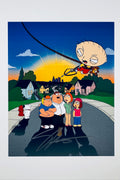 An illustrated art print of the Griffin family standing on a suburban street with Stewie flying overhead on a wire, featuring a silver marker signature across the pavement in the foreground.